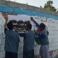 جداريات بمناسبة اليوم التطوعي في قرية المرابي